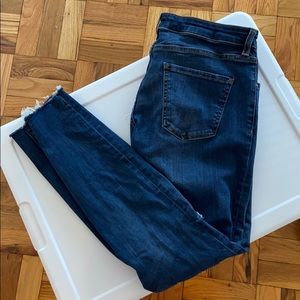 Dark wash jeans with hole in knees